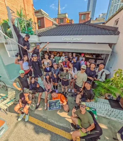 SMCC runners posing for a group photo outside a café