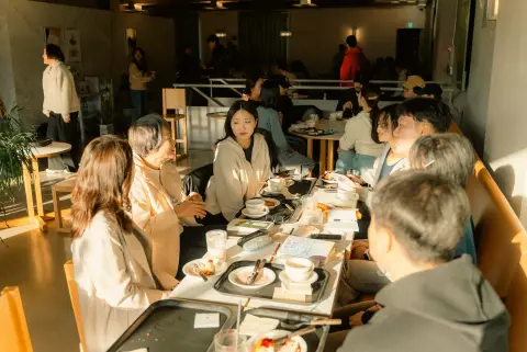 Participants talking around a café table